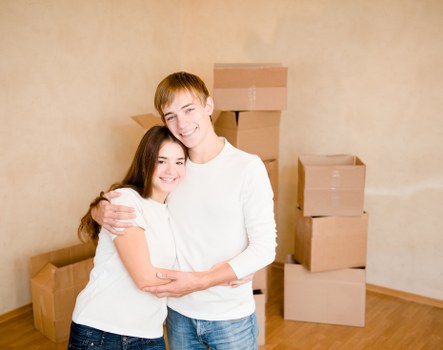 Local team packing fragile household items carefully