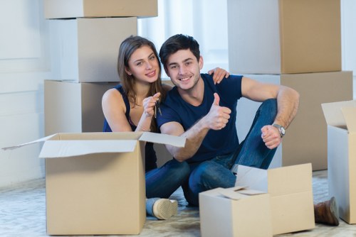 Furniture and household items being loaded into a removal van