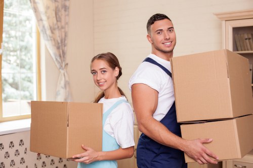 Trained removals staff handling furniture carefully