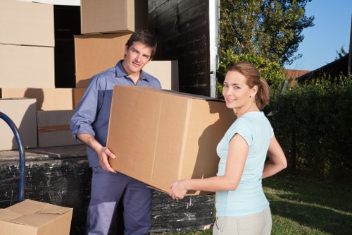 Local moving truck helping with furniture loading in West Wimbledon