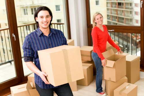 Professional movers navigating a residential street in Westwimbledon
